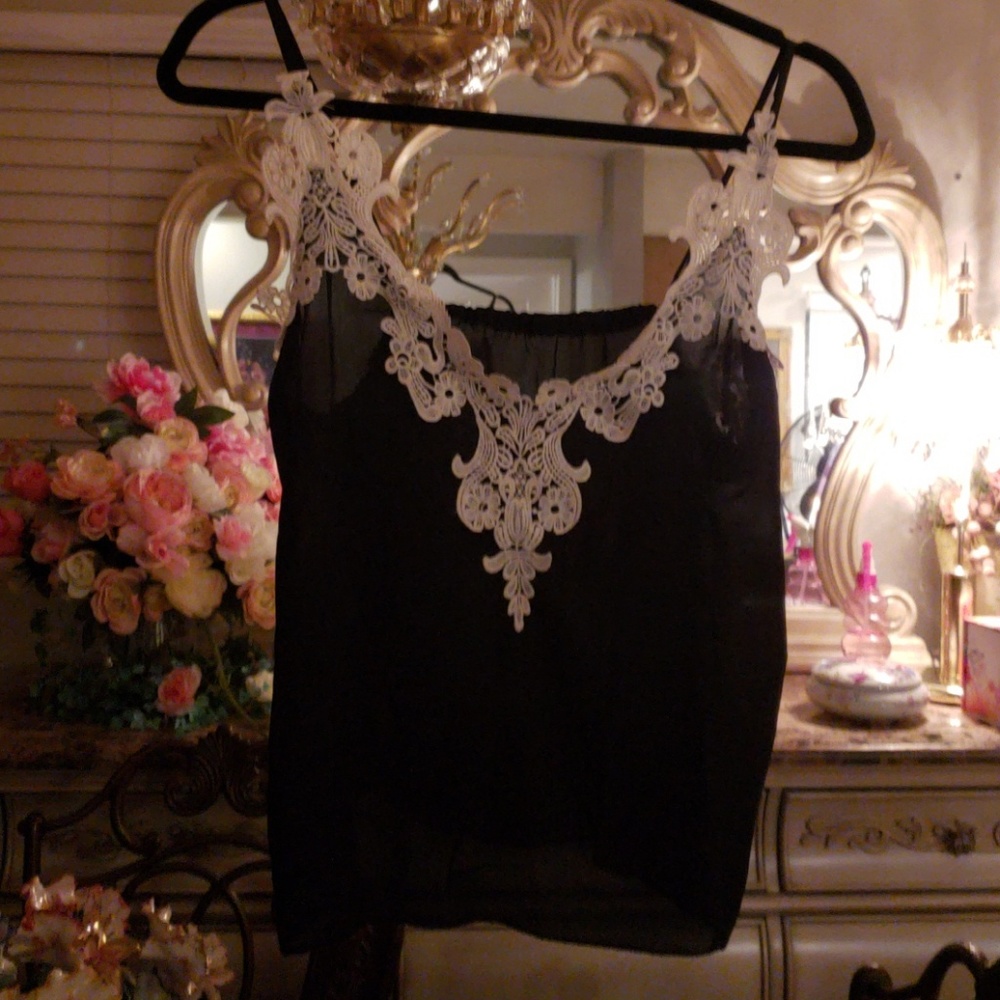Brand new black sheer top